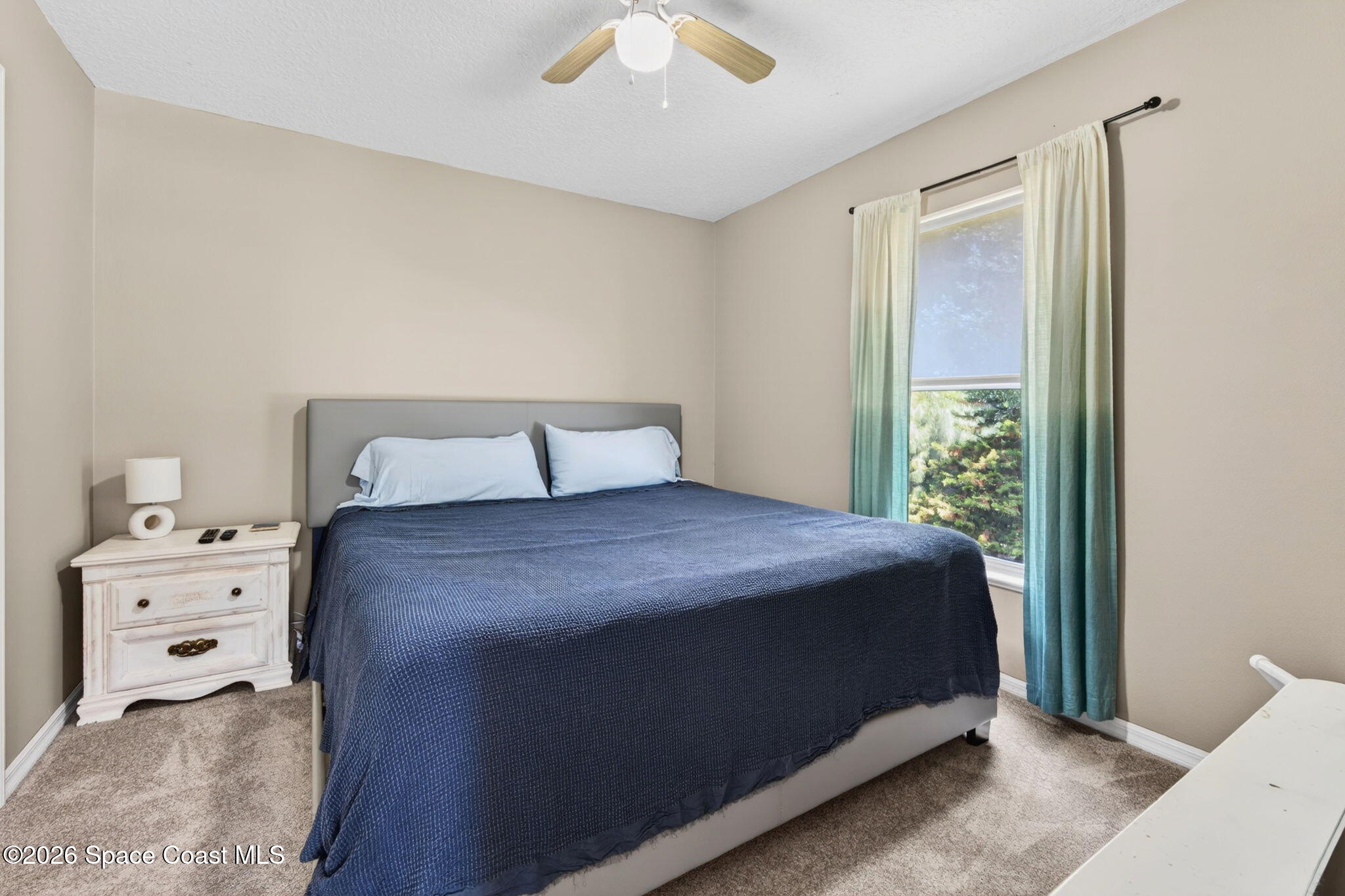 440 Mohawk Trail Merritt Island, FL 32953 - Photo 42 of 86 a bedroom with a bed and a window