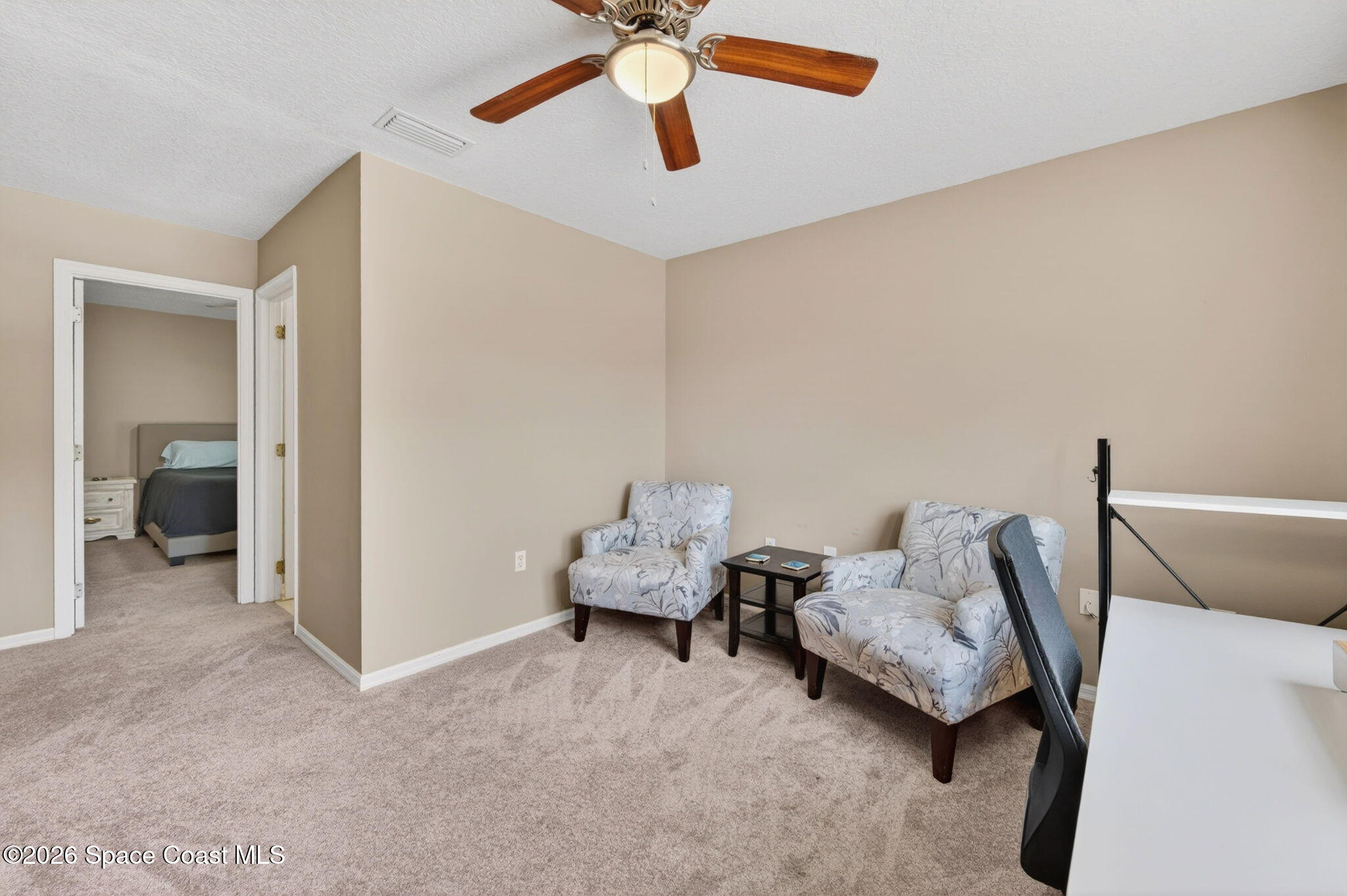 440 Mohawk Trail Merritt Island, FL 32953 - Photo 44 of 86 a living room with furniture and a ceiling fan