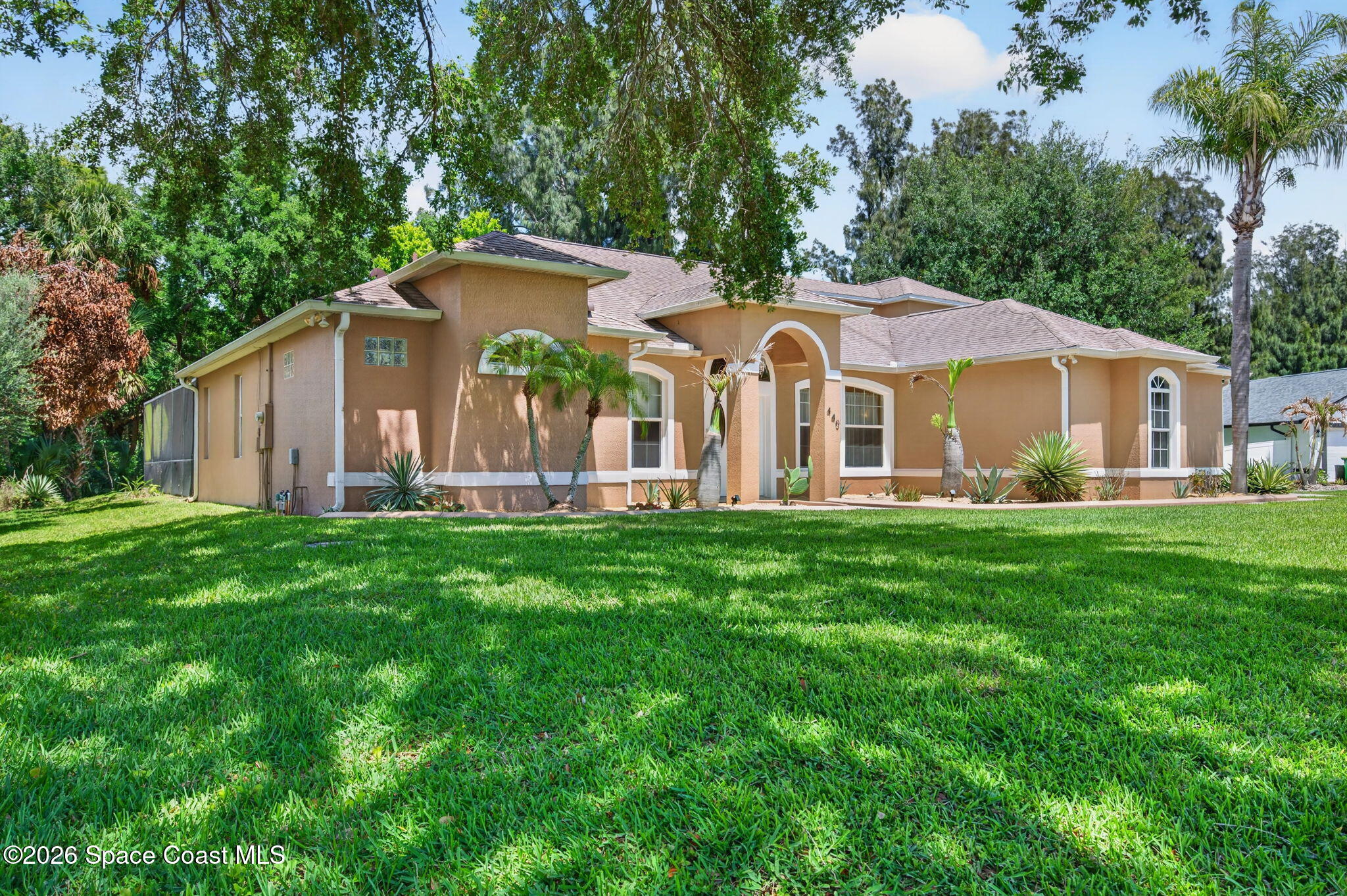 440 Mohawk Trail Merritt Island, FL 32953 - Photo 60 of 86 a front view of house with yard and green space
