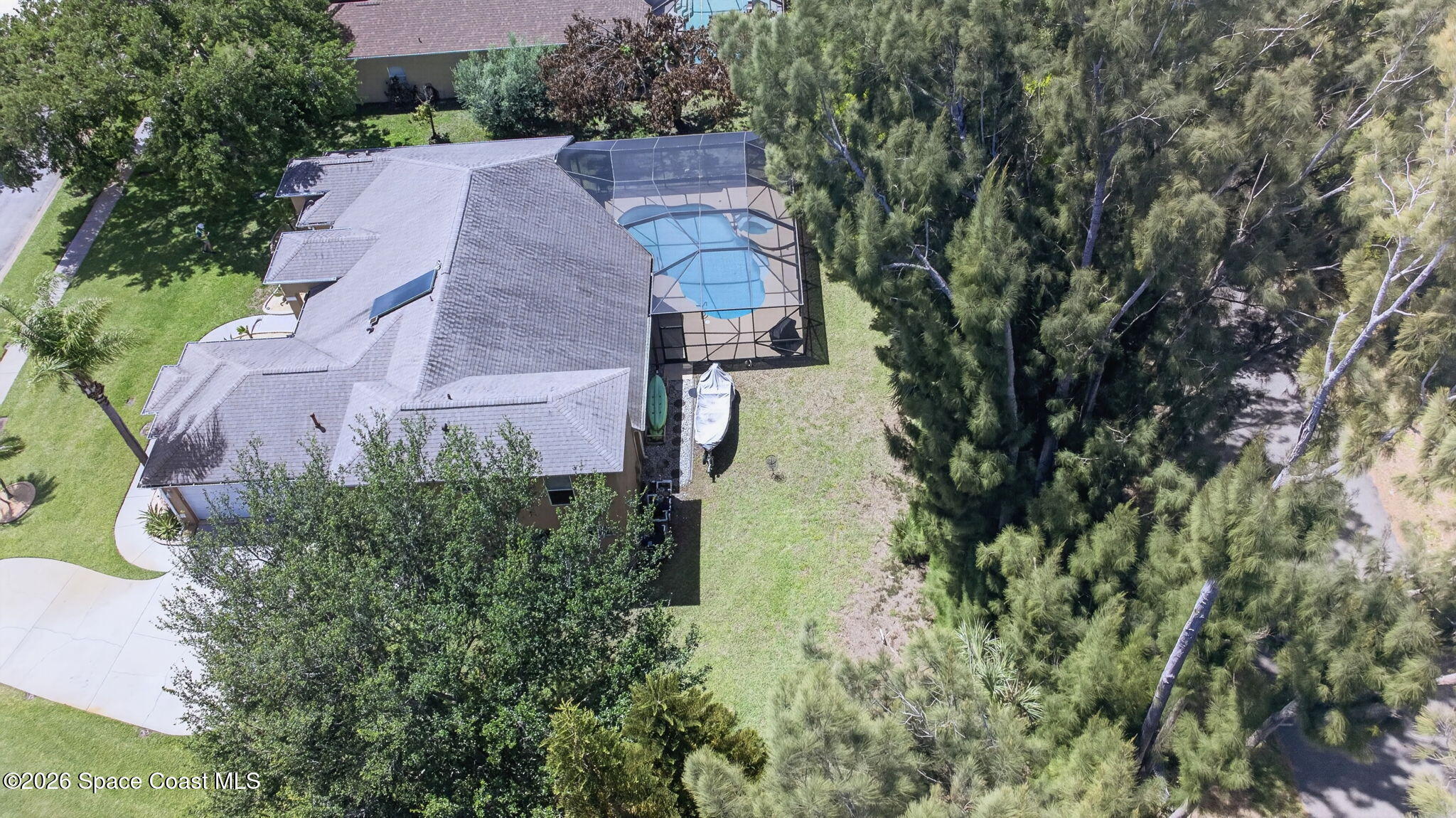 440 Mohawk Trail Merritt Island, FL 32953 - Photo 79 of 86 an aerial view of a house with a garden and trees