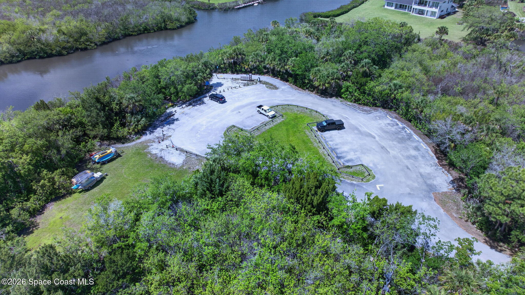 440 Mohawk Trail Merritt Island, FL 32953 - Photo 80 of 86 an aerial view of residential house with outdoor space and trees all around