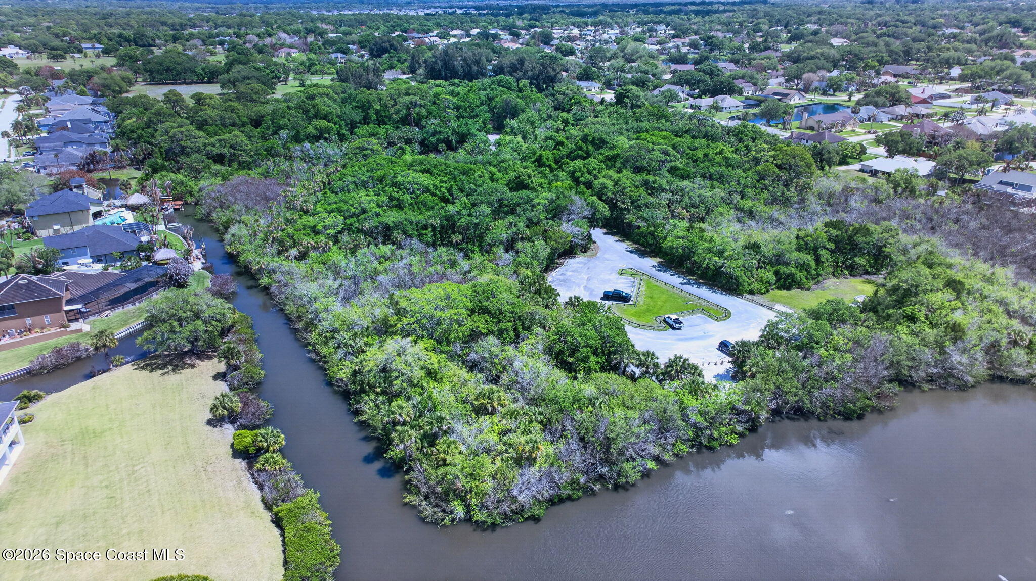 440 Mohawk Trail Merritt Island, FL 32953 - Photo 84 of 86 an aerial view of a house with a yard and outdoor seating