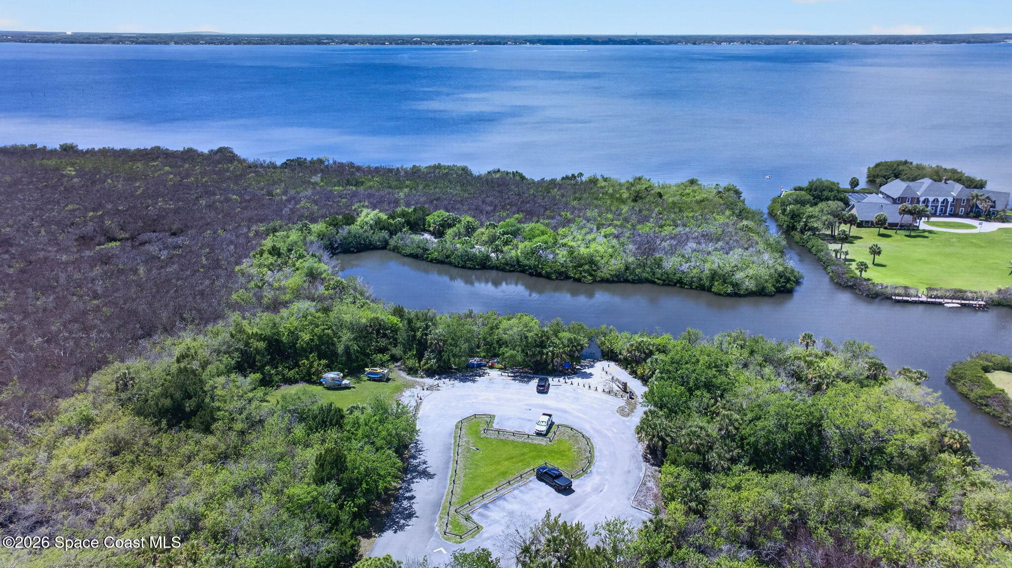 440 Mohawk Trail Merritt Island, FL 32953 - Photo 85 of 86 an aerial view of lake residential house with swimming pool and green space