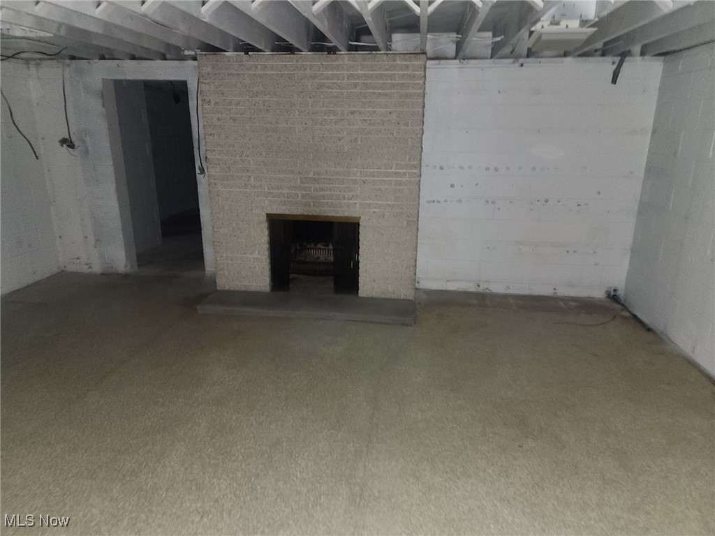 7516 Mayfield Road Chesterland, OH 44026 - Photo 21 of 21 Unfinished basement featuring a fireplace