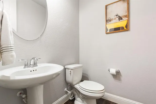 a living room with furniture a flat screen tv and a couch