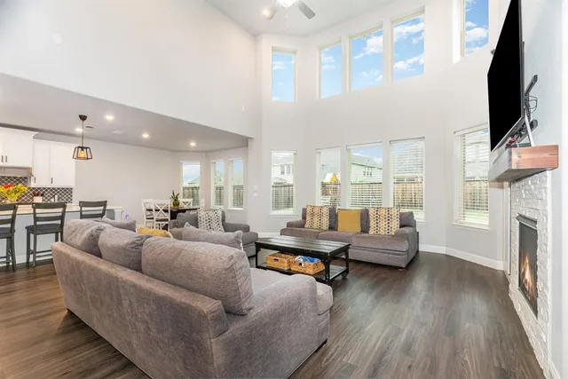 a living room with fireplace furniture and a flat screen tv
