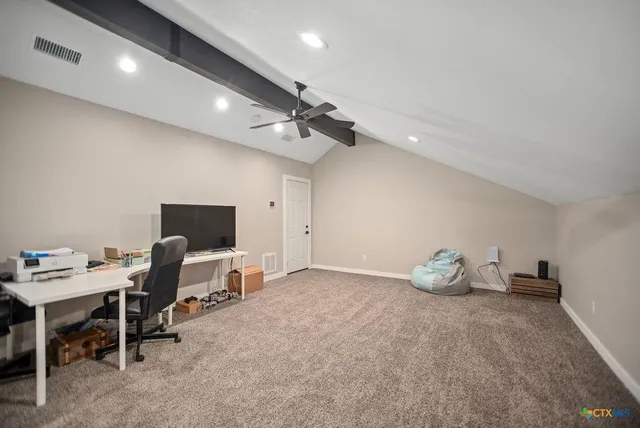 a view of work space with windows and a ceiling fan