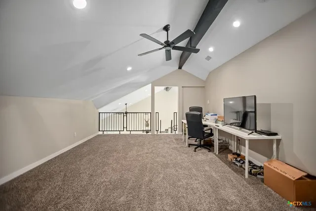 wooden floor & ceiling fan in a room