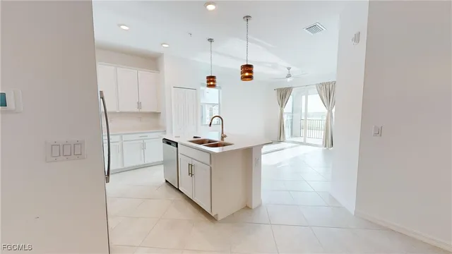 a spacious bathroom with a double vanity sink and a mirror
