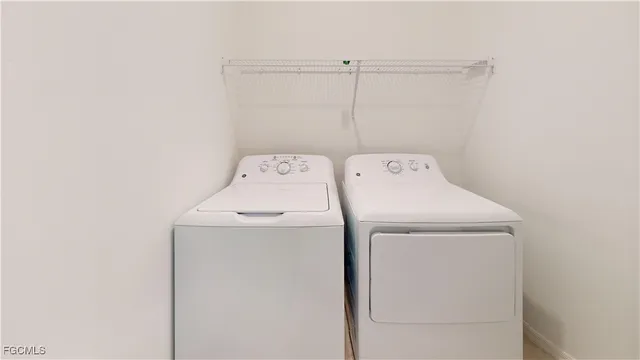 a view of a swimming pool with a table and chairs