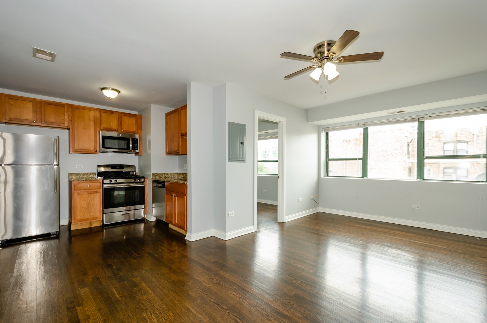 7616 North Marshfield Avenue, Unit 302 Chicago, IL 60626 - Photo 2 of 10 a kitchen with a refrigerator and a stove top oven