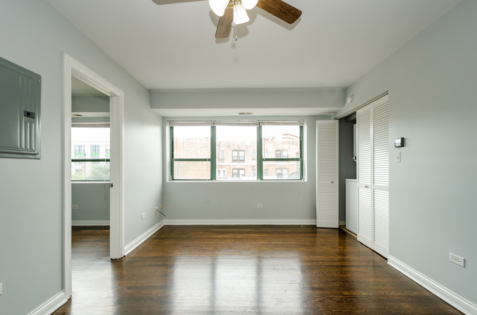 7616 North Marshfield Avenue, Unit 302 Chicago, IL 60626 - Photo 5 of 10 wooden floor in an empty room with a window