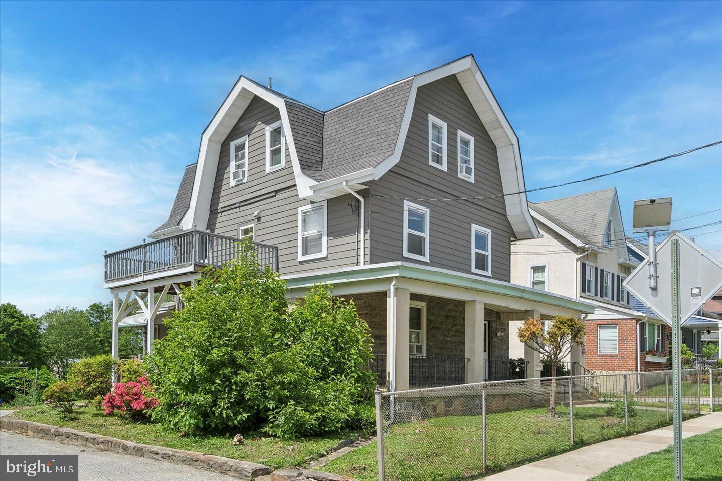 660 Loraine Street, Unit 2 Ardmore, PA 19003 - Photo 1 of 16 a front view of a house with garden