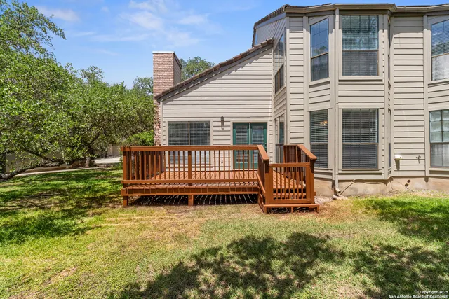 a backyard of a house with a deck