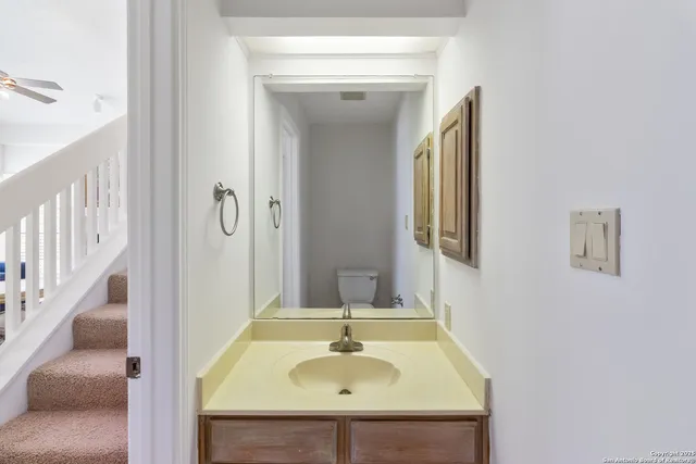 a en suite bathroom with a sink and mirror