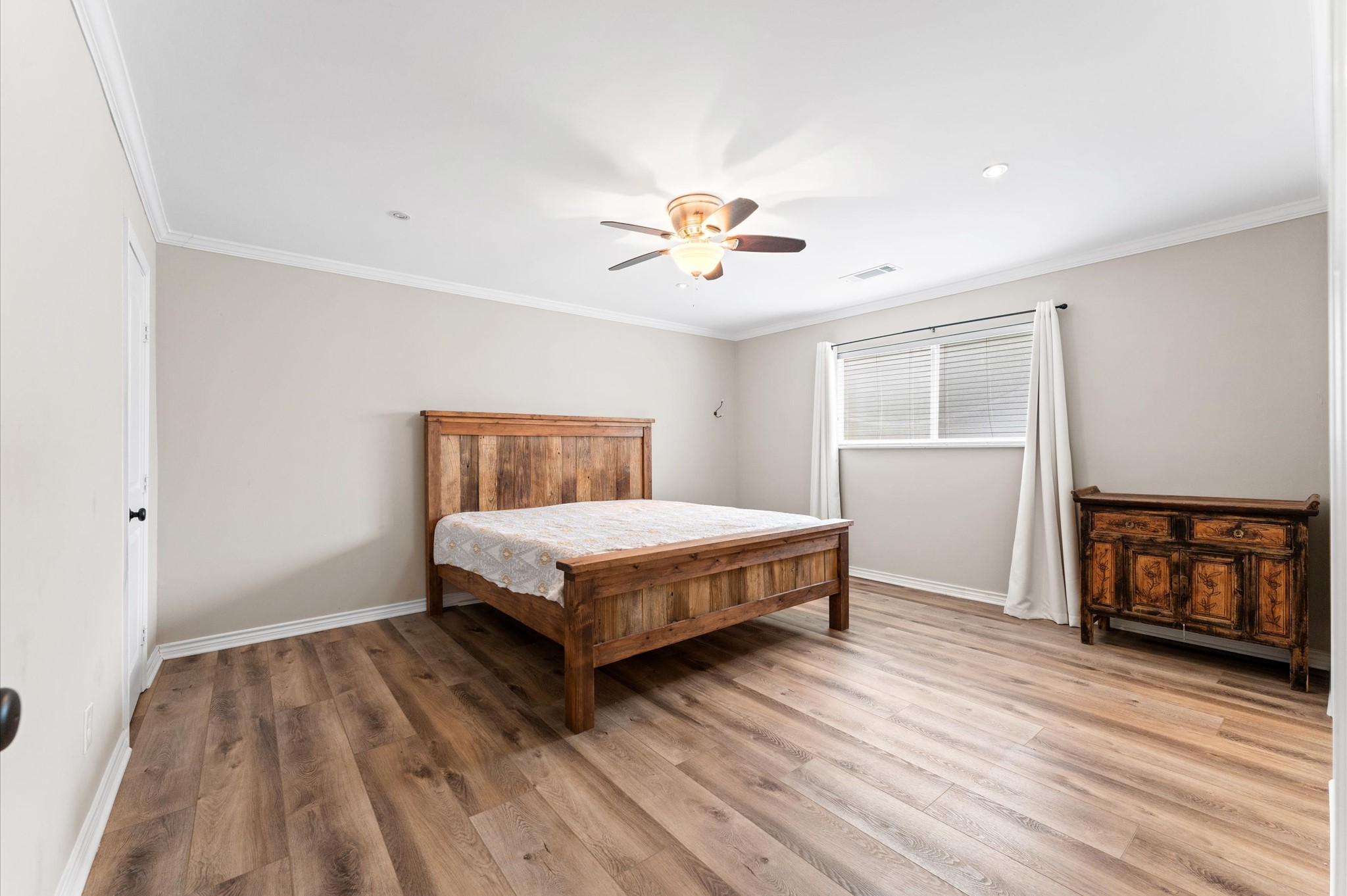 9407 Brooding Oak Circle Houston, TX 77096 - Photo 17 of 43 a bedroom with a bed and a window
