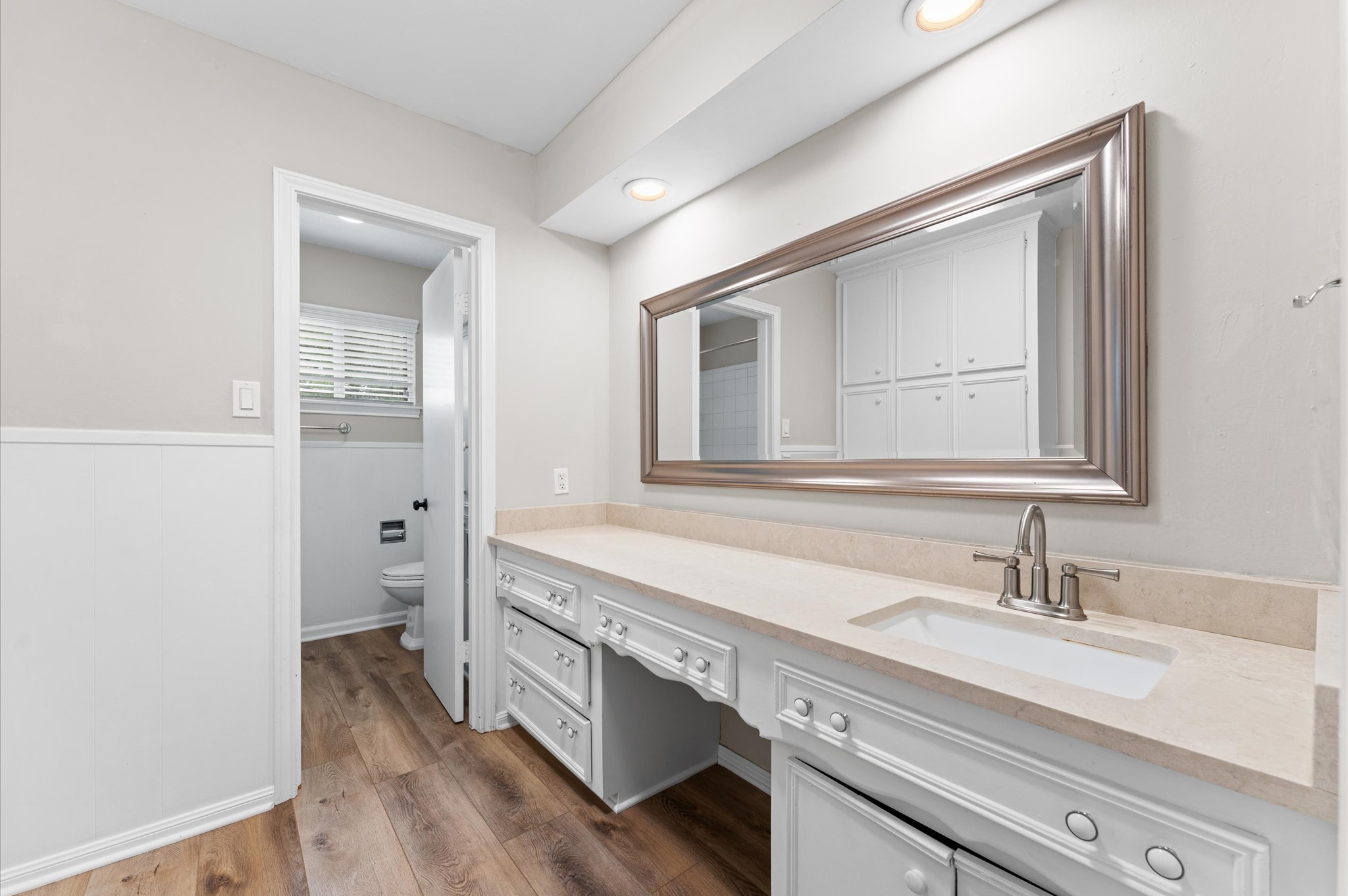 9407 Brooding Oak Circle Houston, TX 77096 - Photo 20 of 43 a spacious bathroom with a double vanity sink a mirror and a bathtub