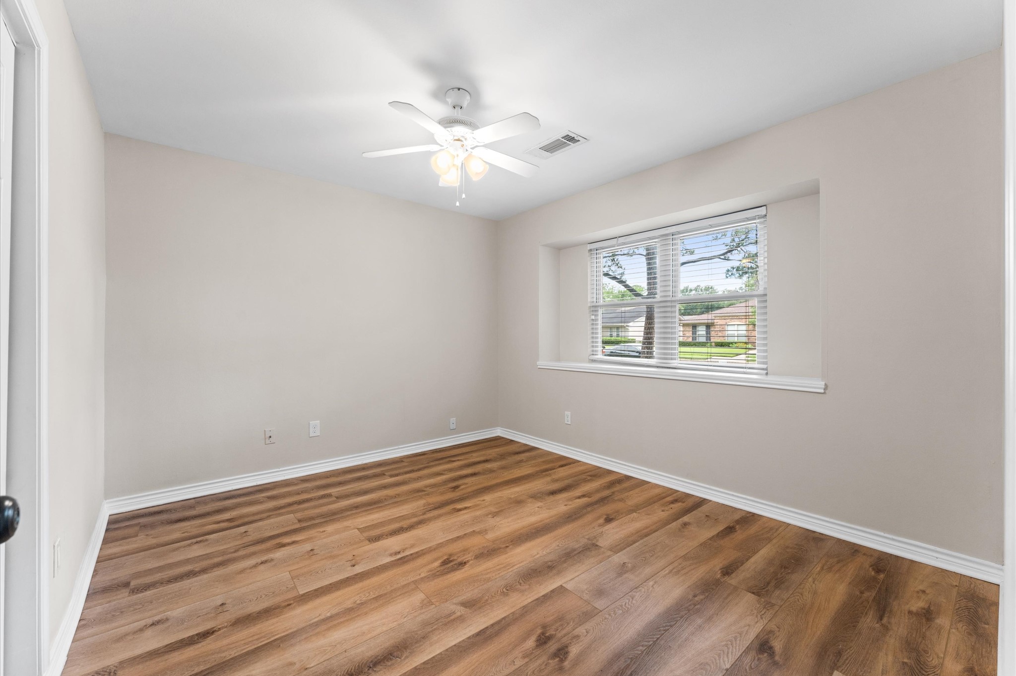 9407 Brooding Oak Circle Houston, TX 77096 - Photo 21 of 43 a view of room with window and ceiling fan