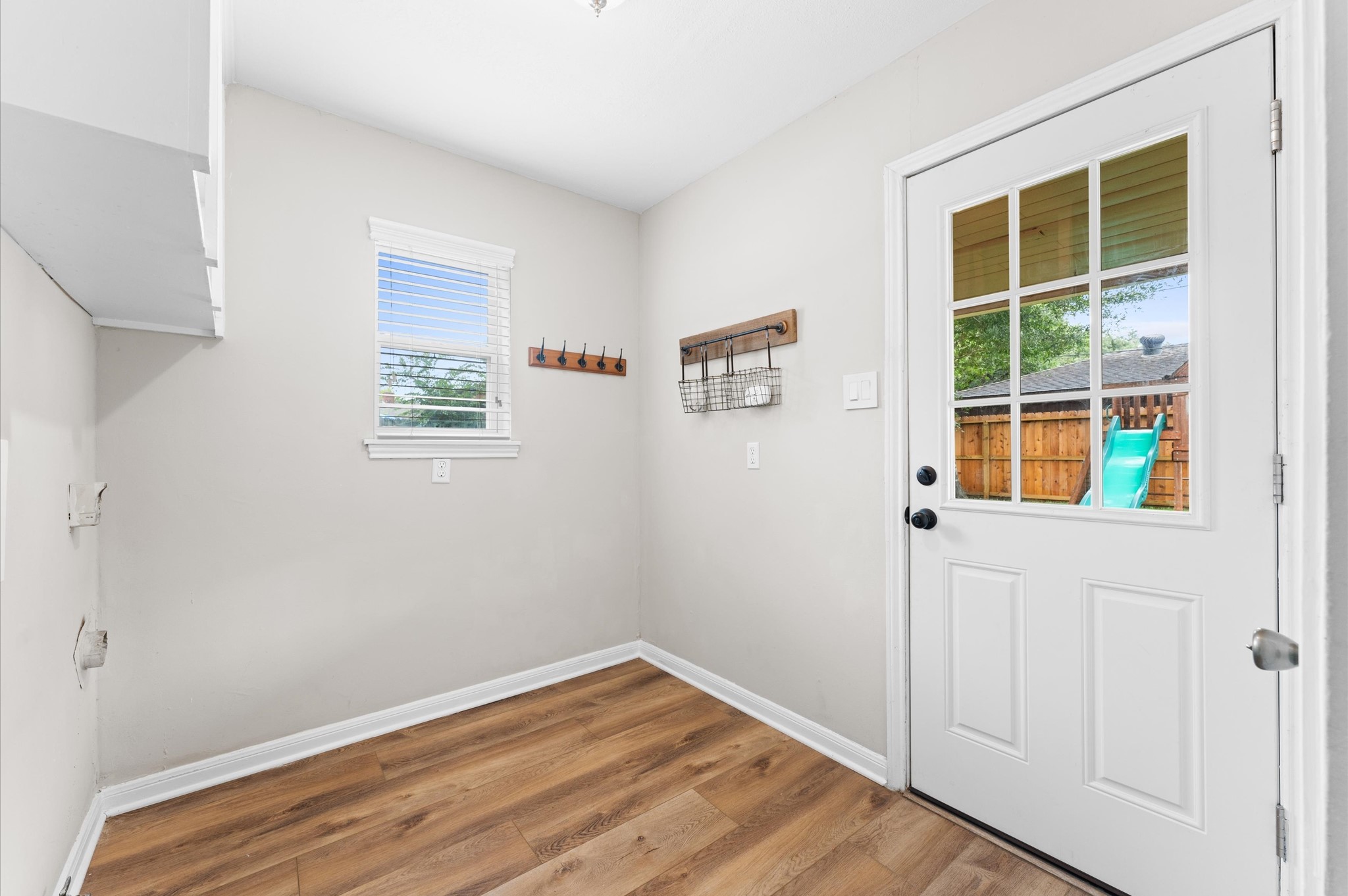 9407 Brooding Oak Circle Houston, TX 77096 - Photo 26 of 43 a view of an empty room with wooden floor and a window
