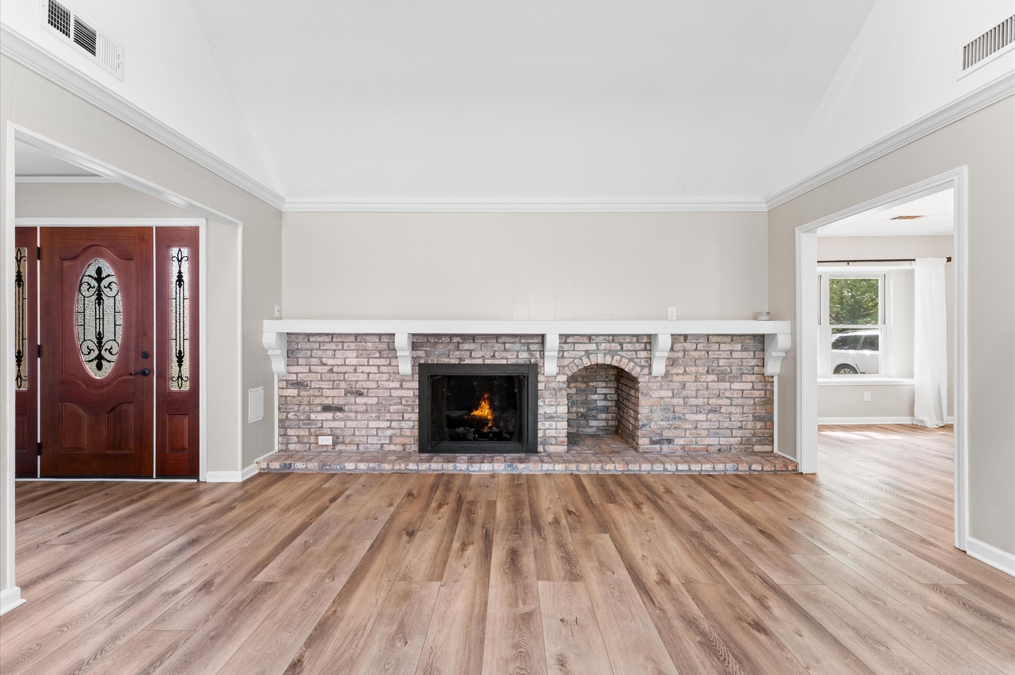 9407 Brooding Oak Circle Houston, TX 77096 - Photo 7 of 43 wooden floor fireplace and windows in an empty room
