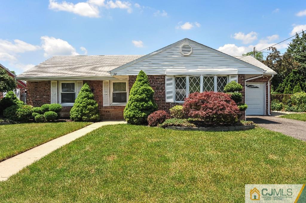 20 Roger Road Edison, NJ 08817 - Photo 1 of 25 a front view of a house with garden