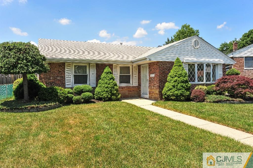 20 Roger Road Edison, NJ 08817 - Photo 2 of 25 a front view of a house with a yard and potted plants