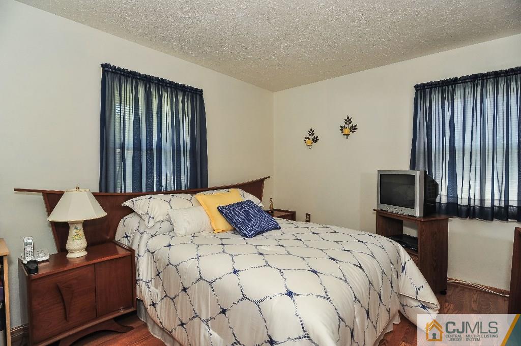 20 Roger Road Edison, NJ 08817 - Photo 16 of 25 a bedroom with a bed and tv