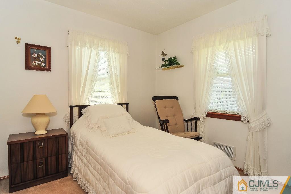20 Roger Road Edison, NJ 08817 - Photo 17 of 25 a bedroom with a bed and wooden floor