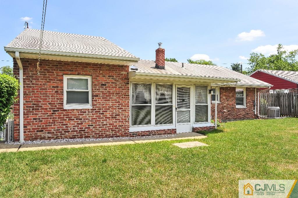 20 Roger Road Edison, NJ 08817 - Photo 22 of 25 a front view of a house with a garden