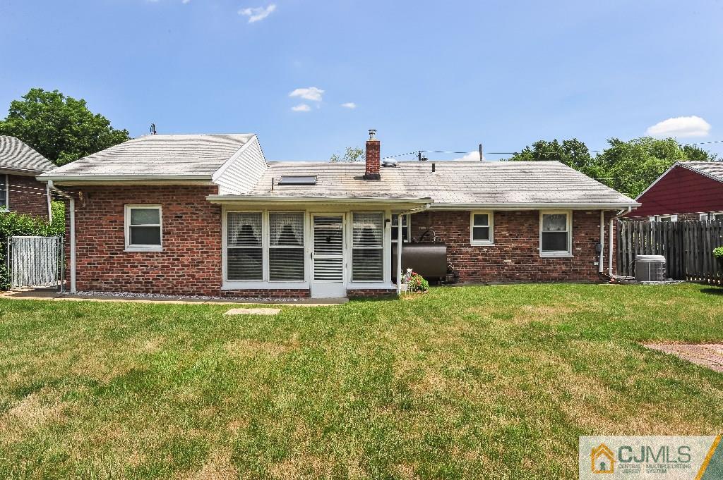 20 Roger Road Edison, NJ 08817 - Photo 23 of 25 a front view of a house with a yard