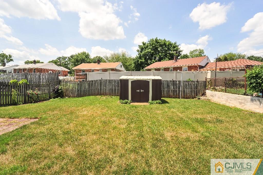 20 Roger Road Edison, NJ 08817 - Photo 24 of 25 a view of a house with a yard and potted plants