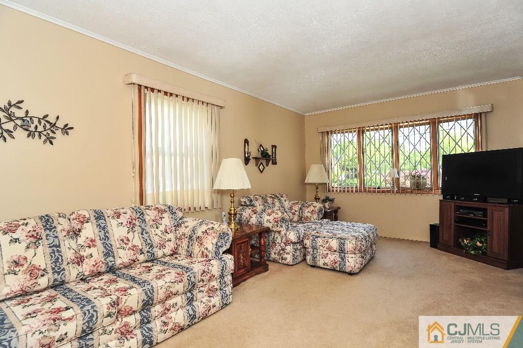 20 Roger Road Edison, NJ 08817 - Photo 5 of 25 a bed room with a bed and a television