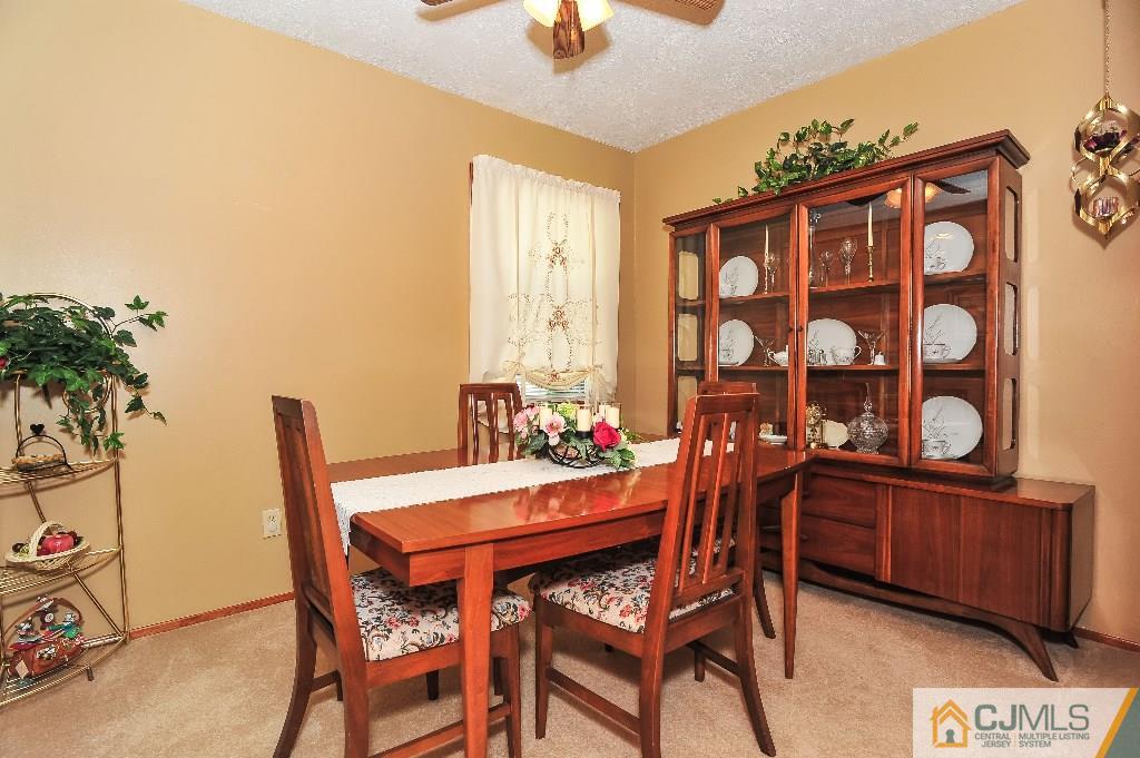 20 Roger Road Edison, NJ 08817 - Photo 9 of 25 a dining room with furniture and wooden floor