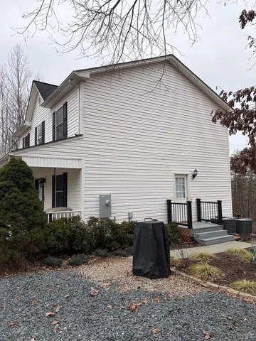 a view of a house with a backyard