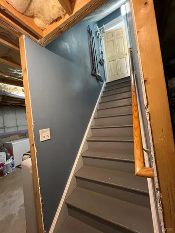 a view of parking garage with cars