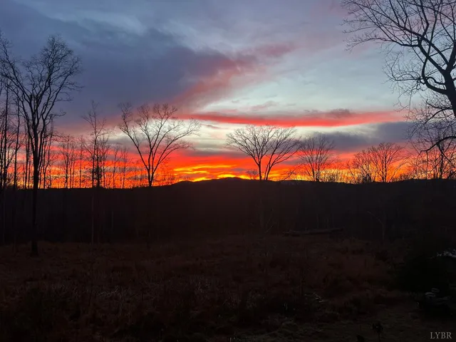 a bedroom with a bed and a night stand