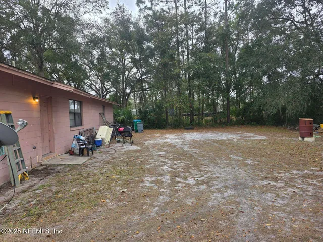 a view of a backyard with a sitting area