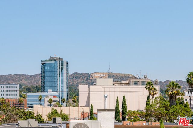 a view of city with tall buildings