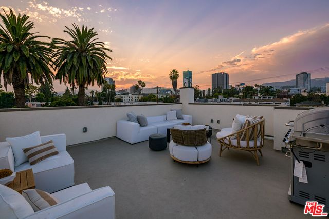 a terrace of a house with outdoor seating