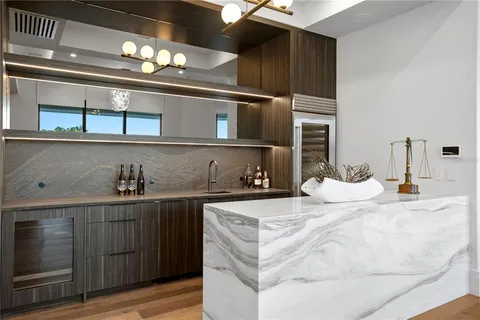 a kitchen with sink stove and cabinets
