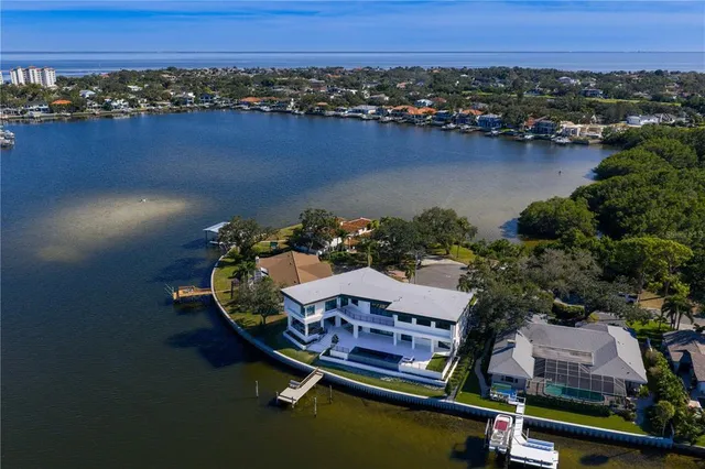 an aerial view of houses with a lake view