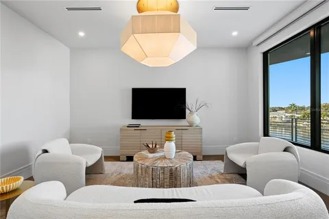 a living room with a large window and a floor