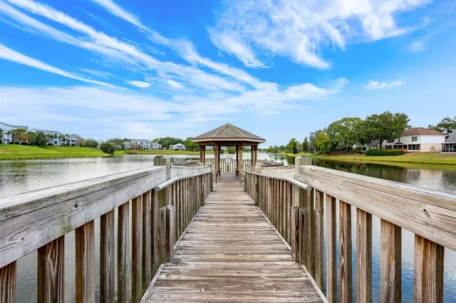 a view of a wooden deck with a backyard