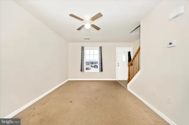 a view of a bathroom with a sink and a mirror