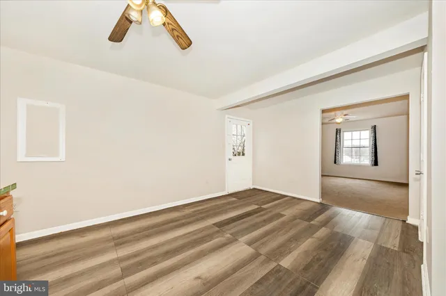 a kitchen with stainless steel appliances granite countertop a refrigerator sink and stove