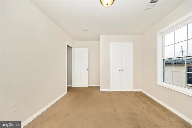a bathroom with a sink a mirror toilet and bathtub