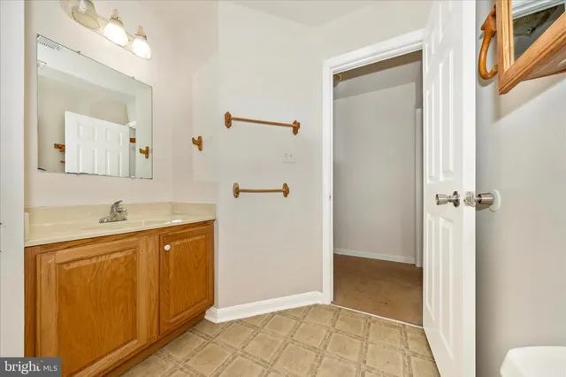 a bathroom with a sink and a window