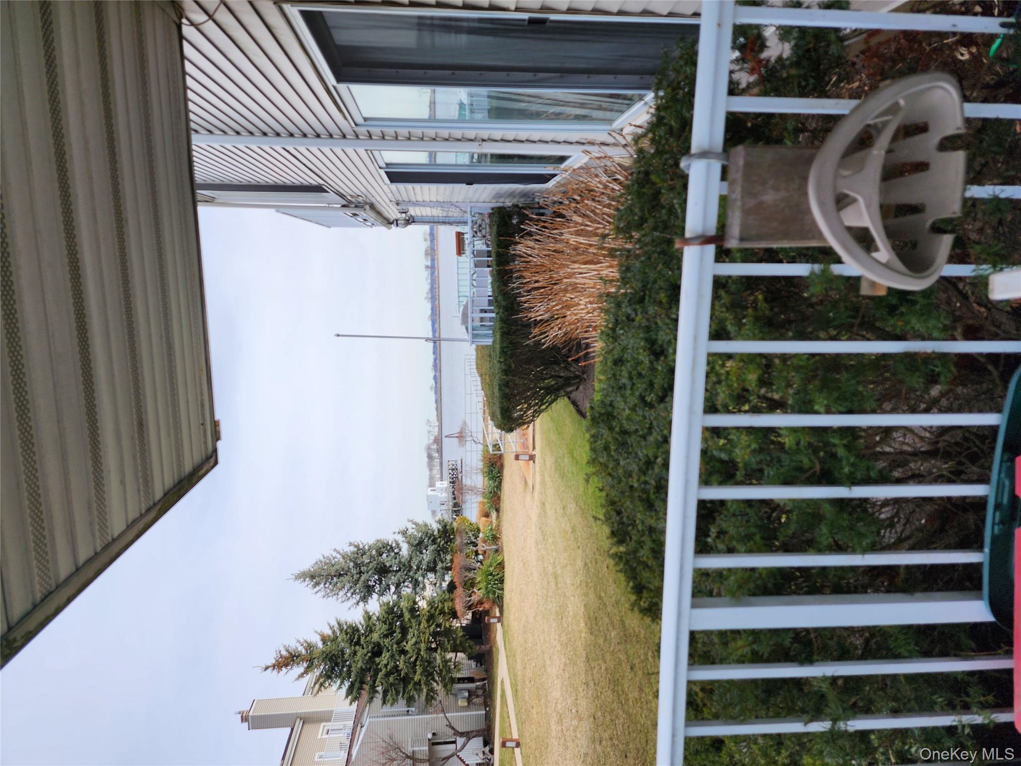 4 Landing Way, Unit 59 Bronx, NY 10464 - Photo 3 of 6 a view of a balcony with an ocean view