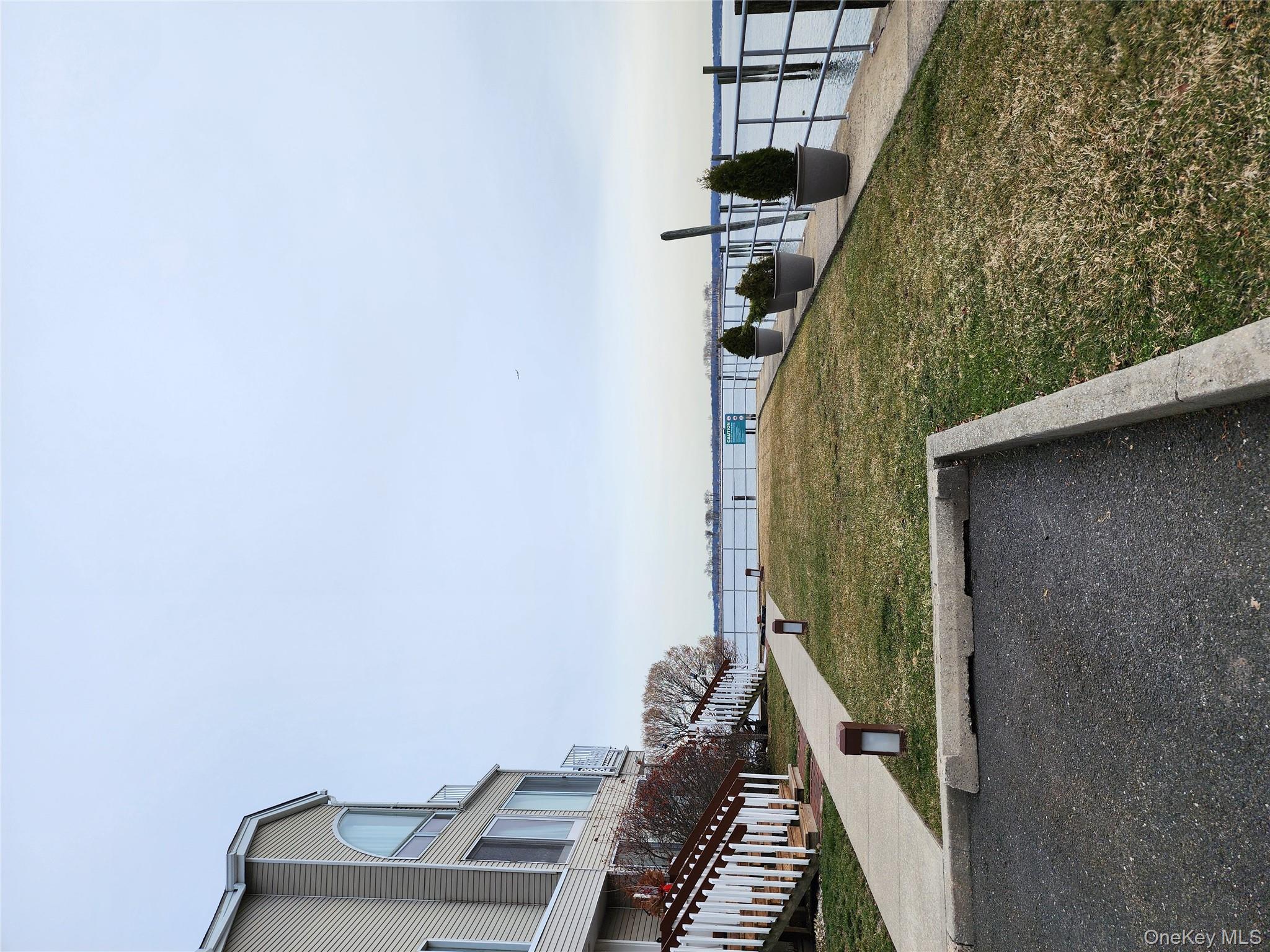 4 Landing Way, Unit 59 Bronx, NY 10464 - Photo 5 of 6 a view of a terrace with chairs