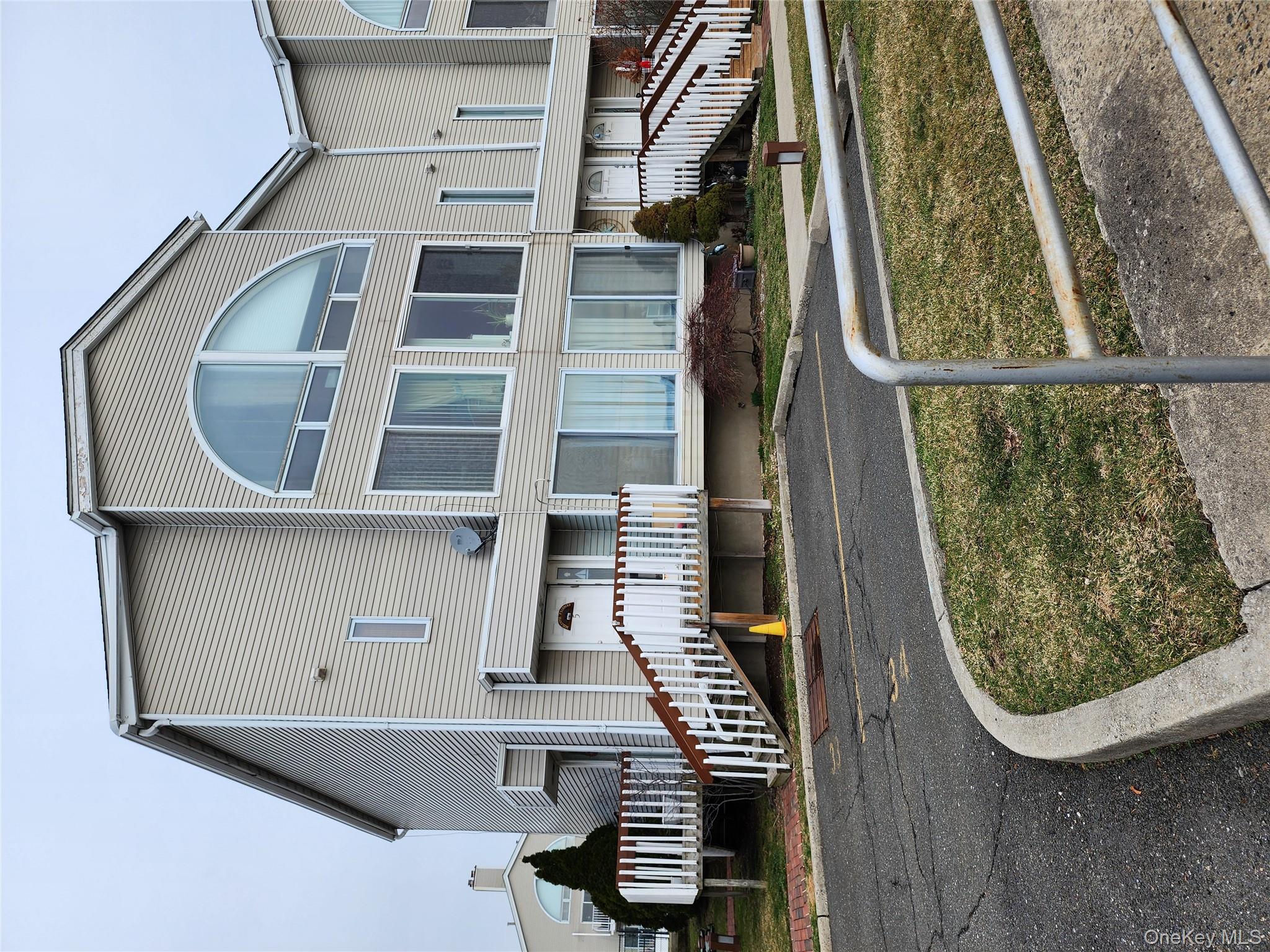 4 Landing Way, Unit 59 Bronx, NY 10464 - Photo 6 of 6 a view of a house with a swimming pool